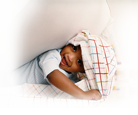 Child Peeking Out of Blanket