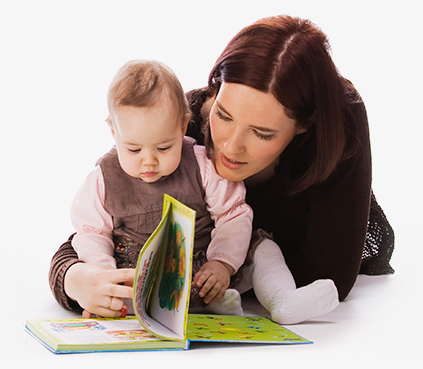 Adult reading book to infant